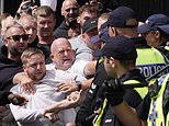 Profiting from chaos: Looters take advantage of riots to steal wine, phones and crocs as they ransack shops in Liverpool, Hull and Manchester as anarchy sweeps Britain, with police officers hospitalised by thugs and clashes between rival groups