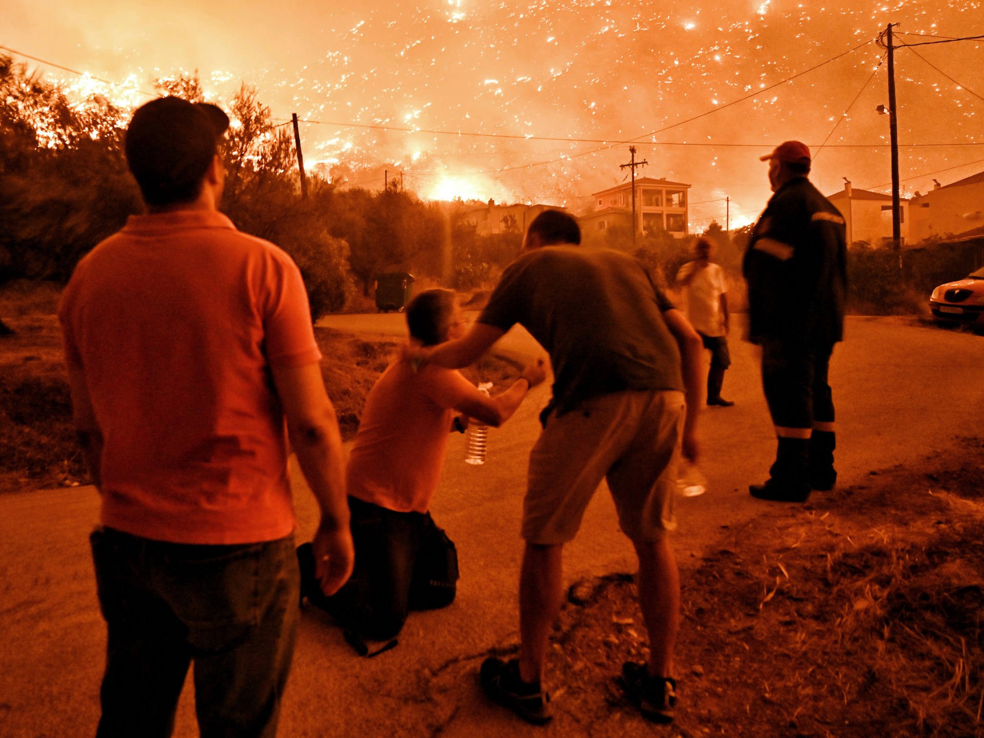 Raging wildfires in central Greece leave two people dead