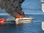 Four Brits are rescued as their luxury 40ft motor yacht explodes into flames before sinking off Spanish holiday island