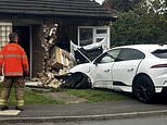 Terrifying moment £80,000 Jaguar I-PACE surges out of control before mounting pavement and ploughing into bungalow