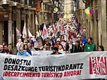 Moment hundreds of ‘anti-tourist’ activists storm the streets of Spain in protest amid wave of campaigning to try to keep holidaymakers away