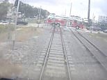 Horrifying moment high speed train struck Florida fire truck whose driver ignored barriers