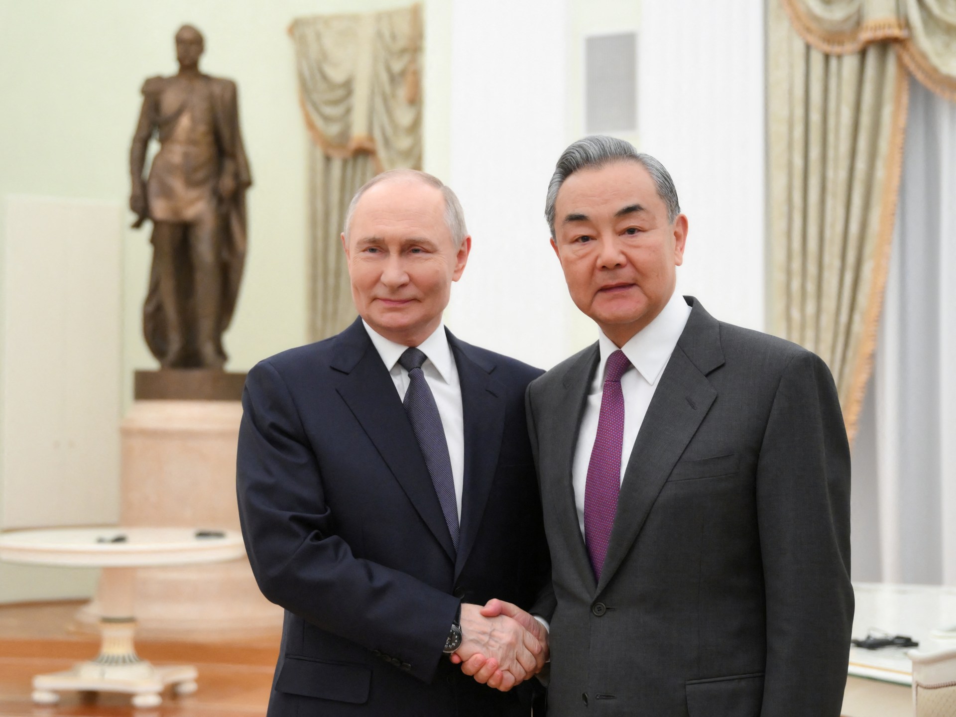 Russia’s Putin hosts Chinese Foreign Minister Wang for talks in Moscow