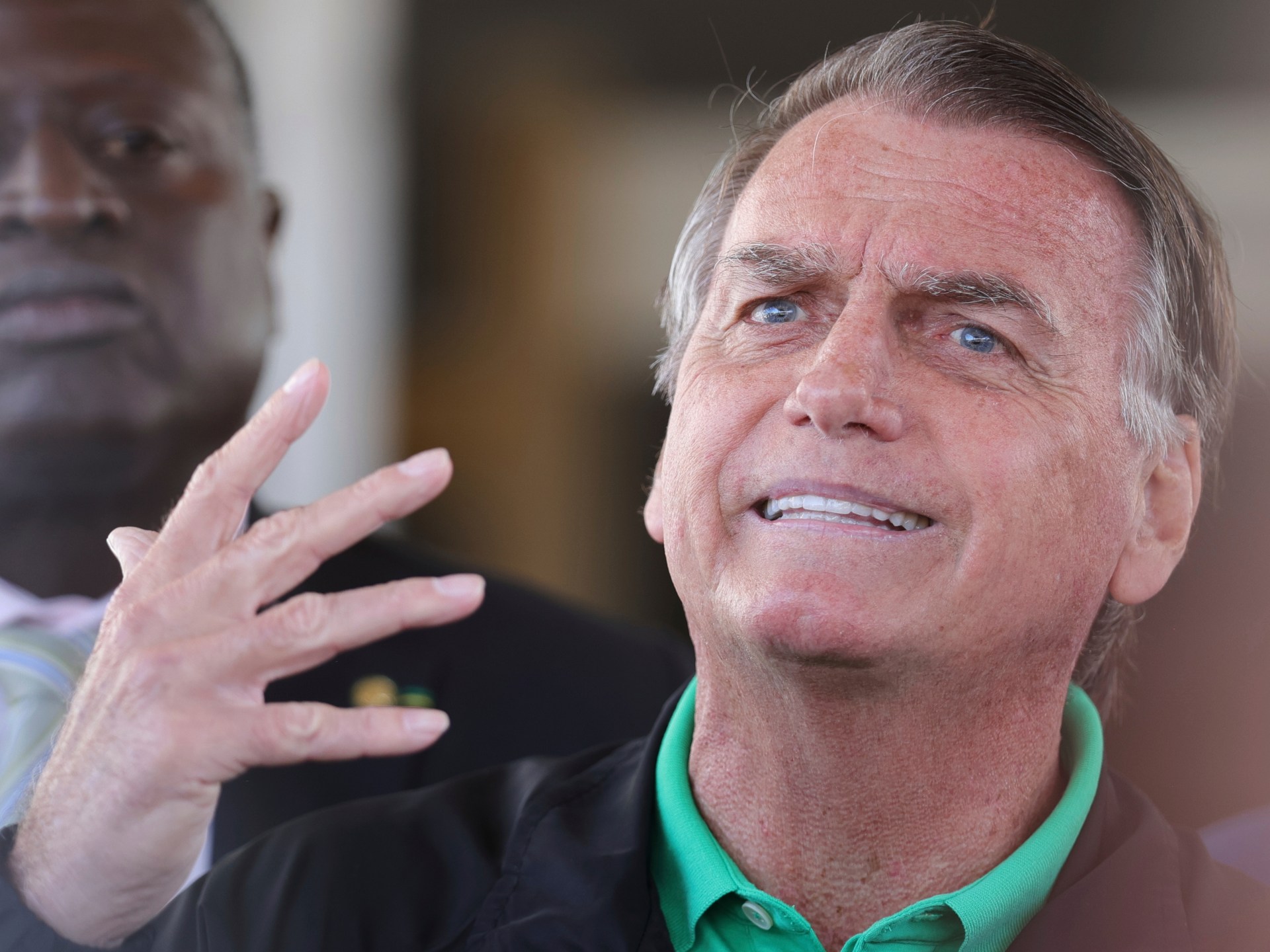 Brazil authorities raid Bolsonaro’s home, require him to wear monitor