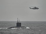 RAF scrambles spy planes as Britain joins huge NATO hunt for Russian sub ‘suspected of threatening US aircraft carrier’ off Norway