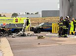 Two dead as plane crashes into Colorado business park and bursts into flames