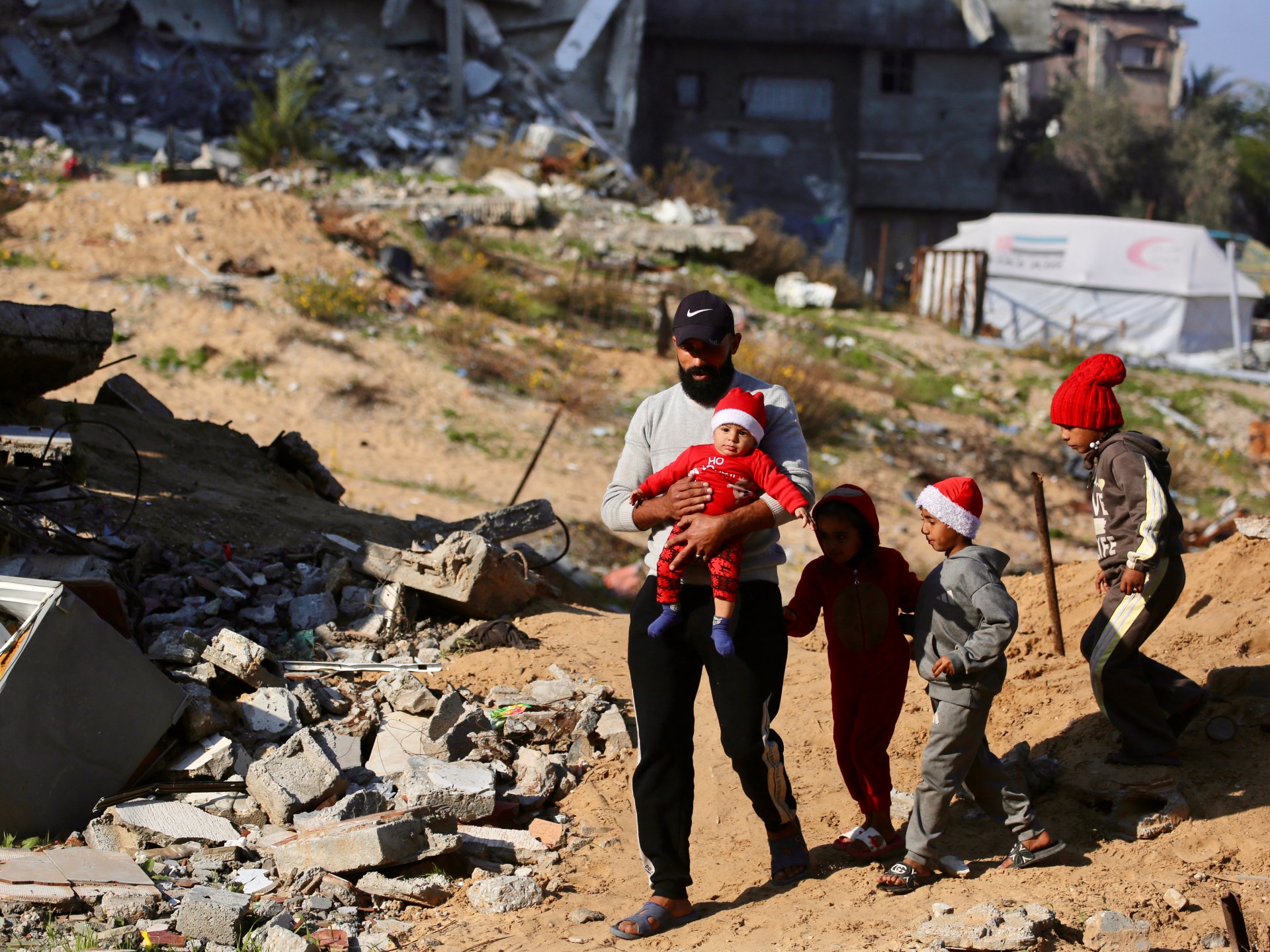 Israeli forces kill Palestinian in Gaza, carry out raids across West Bank