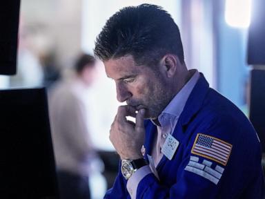 Asian shares are mixed, US futures edge higher as AI fears drag Wall Street lower