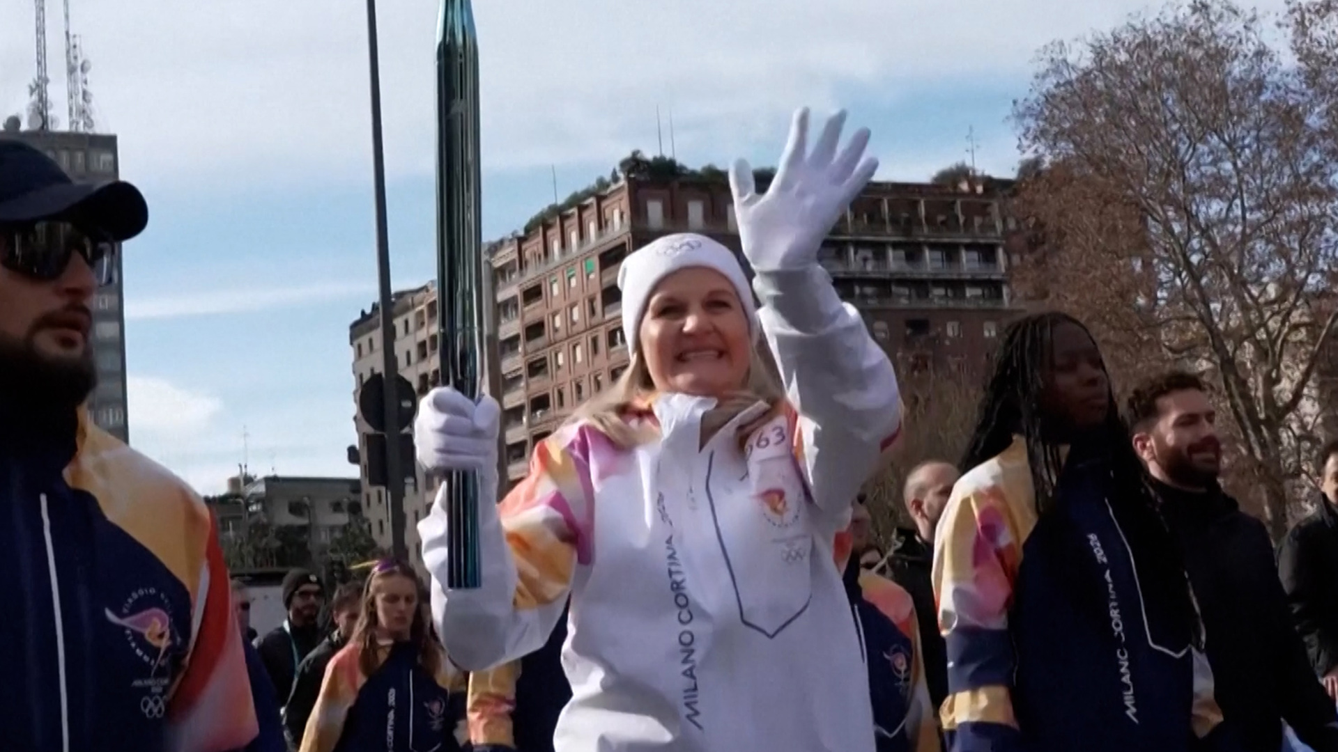 Olympic torch travels through central Milan hours before games