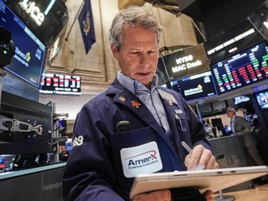 Wall Street opens higher while gold and silver claw back losses