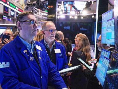 Asian shares are mixed after Wall St sets a record, and the US dollar’s value slides further