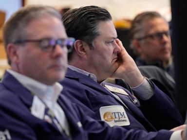 Wall Street slides, oil prices again over $100 a barrel as US and Iran trade threats over ports