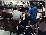 Moment two brazen thieves calmly go through pubgoers’ bags as they stand chatting nearby