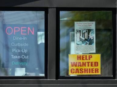 US jobless claims rise to 215,000 but layoffs remain low
