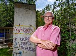 Tear down this wall! Property developer faces council probe after erecting section of the Berlin Wall in his garden without planning permission