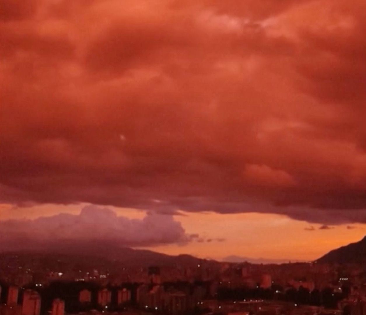Venezuelan sky turns deep red as sun sets over Caracas