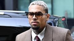 Chris Brown ordered to pay housekeeper $13m after dog attack