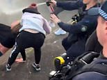 Wild scenes as $5,000 cash giveaway spirals into chaos on the street as police are forced to use pepper spray on crowd: ‘Fear and concern’