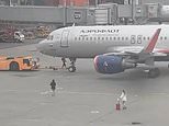 Moment ‘passengers run across tarmac in desperate bid to catch flight’ before they are escorted away