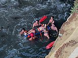 Dramatic rescues unfold at popular swimming spot as TWO more people are injured just days after teen crashed into rocks while cliff jumping